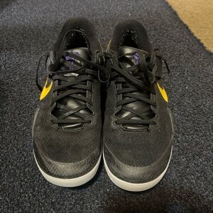Nike Black and Yellow Sneakers with Streamlined Design